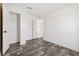 Simple bedroom with wood-look floors and closet at 5234 Yellow Pine N St, St Petersburg, FL 33709