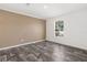 Bright bedroom with wood-look floors and large window at 5234 Yellow Pine N St, St Petersburg, FL 33709