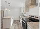 Modern kitchen with stainless steel appliances and granite countertops at 5234 Yellow Pine N St, St Petersburg, FL 33709