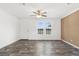 Spacious living room with wood-look flooring and a ceiling fan at 5234 Yellow Pine N St, St Petersburg, FL 33709