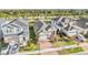 Aerial view of three-story houses with two-car garages and lush green lawns at 5613 Del Coronado Dr, Apollo Beach, FL 33572