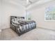 Spacious bedroom with grey carpet and large bed at 5613 Del Coronado Dr, Apollo Beach, FL 33572