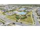 Aerial view of community pool, playground, and neighborhood at 5613 Del Coronado Dr, Apollo Beach, FL 33572