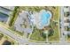 Aerial view of community pool with surrounding lounge chairs and playground at 5613 Del Coronado Dr, Apollo Beach, FL 33572