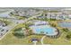 Aerial view of community pool with playground and surrounding neighborhood at 5613 Del Coronado Dr, Apollo Beach, FL 33572
