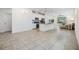 Open concept kitchen with island and stainless steel appliances at 5613 Del Coronado Dr, Apollo Beach, FL 33572