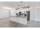 Modern kitchen with white cabinets, stainless steel appliances, and grey countertops at 5613 Del Coronado Dr, Apollo Beach, FL 33572