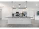 Modern kitchen with white cabinets, gray countertops and island at 5613 Del Coronado Dr, Apollo Beach, FL 33572