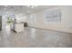 Open concept kitchen and dining area with tile floors and island at 5613 Del Coronado Dr, Apollo Beach, FL 33572