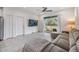 Spacious living room with gray sectional sofa and sliding glass doors at 5613 Del Coronado Dr, Apollo Beach, FL 33572