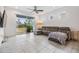 Living room with gray sectional and access to backyard at 5613 Del Coronado Dr, Apollo Beach, FL 33572