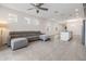 Open living room with gray sectional sofa and views into kitchen area at 5613 Del Coronado Dr, Apollo Beach, FL 33572