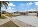 House exterior with carport and landscaped yard at 7611 Reindeer Rd, Tampa, FL 33619