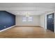 Bright and airy living room with hardwood floors and accent wall at 7611 Reindeer Rd, Tampa, FL 33619