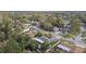 Residential neighborhood with mature trees and various home styles at 775 Rolling Hills Dr, Palm Harbor, FL 34683
