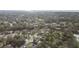 Aerial view of residential neighborhood showcasing homes and lush landscaping at 775 Rolling Hills Dr, Palm Harbor, FL 34683
