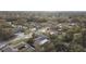 Residential neighborhood with mature trees and various home styles at 775 Rolling Hills Dr, Palm Harbor, FL 34683