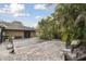 Large backyard with patio and seating area at 775 Rolling Hills Dr, Palm Harbor, FL 34683