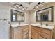 Double vanity bathroom with two sinks and large mirrors at 775 Rolling Hills Dr, Palm Harbor, FL 34683