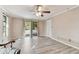 Spacious bedroom with hardwood floors and access to patio at 775 Rolling Hills Dr, Palm Harbor, FL 34683