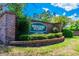 Westlake Village entrance sign with brick pillars and landscaping at 775 Rolling Hills Dr, Palm Harbor, FL 34683
