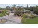 Single story home with brick paver driveway and lush landscaping at 775 Rolling Hills Dr, Palm Harbor, FL 34683