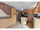 Kitchen with oak cabinets, granite counters, and island at 775 Rolling Hills Dr, Palm Harbor, FL 34683