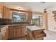 Kitchen with oak cabinets, granite counters and island at 775 Rolling Hills Dr, Palm Harbor, FL 34683