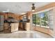 Bright kitchen with oak cabinets and a large window at 775 Rolling Hills Dr, Palm Harbor, FL 34683