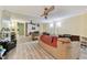 Living area with hardwood floors and view of the kitchen at 775 Rolling Hills Dr, Palm Harbor, FL 34683