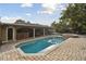Refreshing pool with spacious patio area at 775 Rolling Hills Dr, Palm Harbor, FL 34683