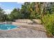Expansive pool and brick patio area at 775 Rolling Hills Dr, Palm Harbor, FL 34683