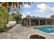 View of the refreshing pool and spacious patio at 775 Rolling Hills Dr, Palm Harbor, FL 34683