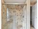 Large shower with tiled walls and glass enclosure at 775 Rolling Hills Dr, Palm Harbor, FL 34683