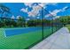 Well-maintained tennis courts with chain link fencing at 775 Rolling Hills Dr, Palm Harbor, FL 34683