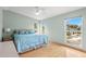 Bright bedroom with king-size bed and water views at 800 Missouri Ave, Palm Harbor, FL 34683