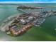 Aerial view showcasing waterfront property with marina and bridge views at 851 Bayway Blvd # 201, Clearwater, FL 33767