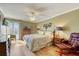Primary bedroom with king bed and ceiling fan at 851 Bayway Blvd # 201, Clearwater, FL 33767