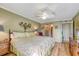 Primary bedroom with king bed and ceiling fan at 851 Bayway Blvd # 201, Clearwater, FL 33767