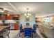 Bright dining area with seating for six and view to living room at 851 Bayway Blvd # 201, Clearwater, FL 33767