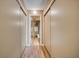 Hallway with mirrored closet doors and tile flooring at 851 Bayway Blvd # 201, Clearwater, FL 33767