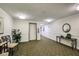Building hallway with elevator access and seating area at 851 Bayway Blvd # 201, Clearwater, FL 33767