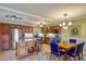 Open kitchen with island, granite counters and stainless steel appliances at 851 Bayway Blvd # 201, Clearwater, FL 33767