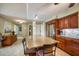 Kitchen island with granite countertop and seating for two at 851 Bayway Blvd # 201, Clearwater, FL 33767