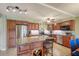 Well-equipped kitchen with island, granite countertops, and wood cabinets at 851 Bayway Blvd # 201, Clearwater, FL 33767