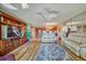 Open living room with hardwood floors, leather furniture and view to kitchen at 851 Bayway Blvd # 201, Clearwater, FL 33767