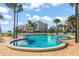 Inviting community pool with surrounding lounge chairs and ocean views at 851 Bayway Blvd # 201, Clearwater, FL 33767