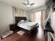 Large bedroom with a king-size bed and dark brown furniture at 9625 Fox Hearst Rd, Tampa, FL 33647