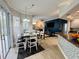 Bright dining area with table and chairs, kitchen access, and backyard view at 9625 Fox Hearst Rd, Tampa, FL 33647