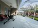 Enclosed patio with home gym and basketball hoop at 9625 Fox Hearst Rd, Tampa, FL 33647